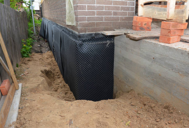 Happy homeowners after waterproofing job in Friendsville